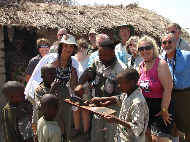 OAT Group and Tanzanians Eating Goat