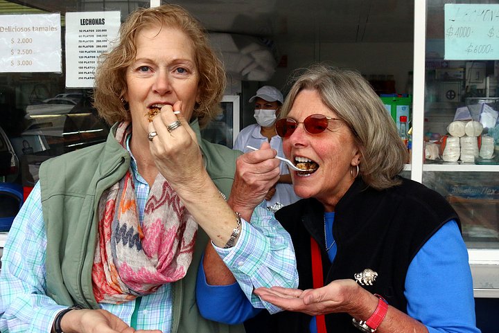 Mary Jo and Gennie enjoying Lechona